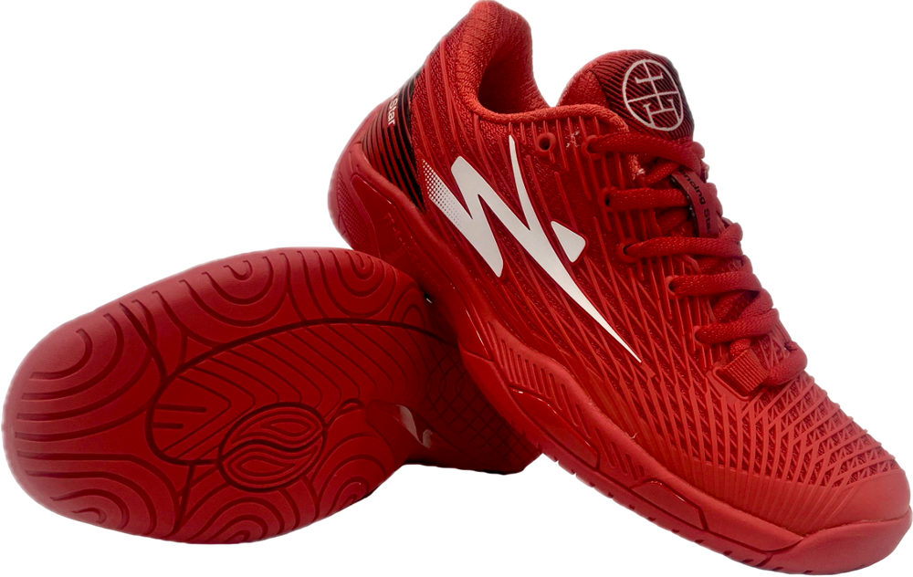 Red athletic sneakers with textured sole and white lightning bolt design, displayed on white background.